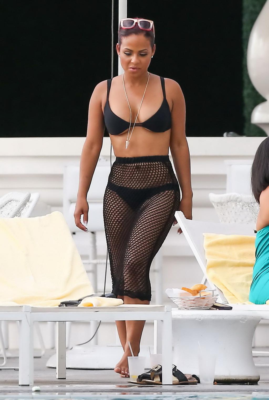16P Christina Milian smoking hot in tiny black bikini poolside in South Beach