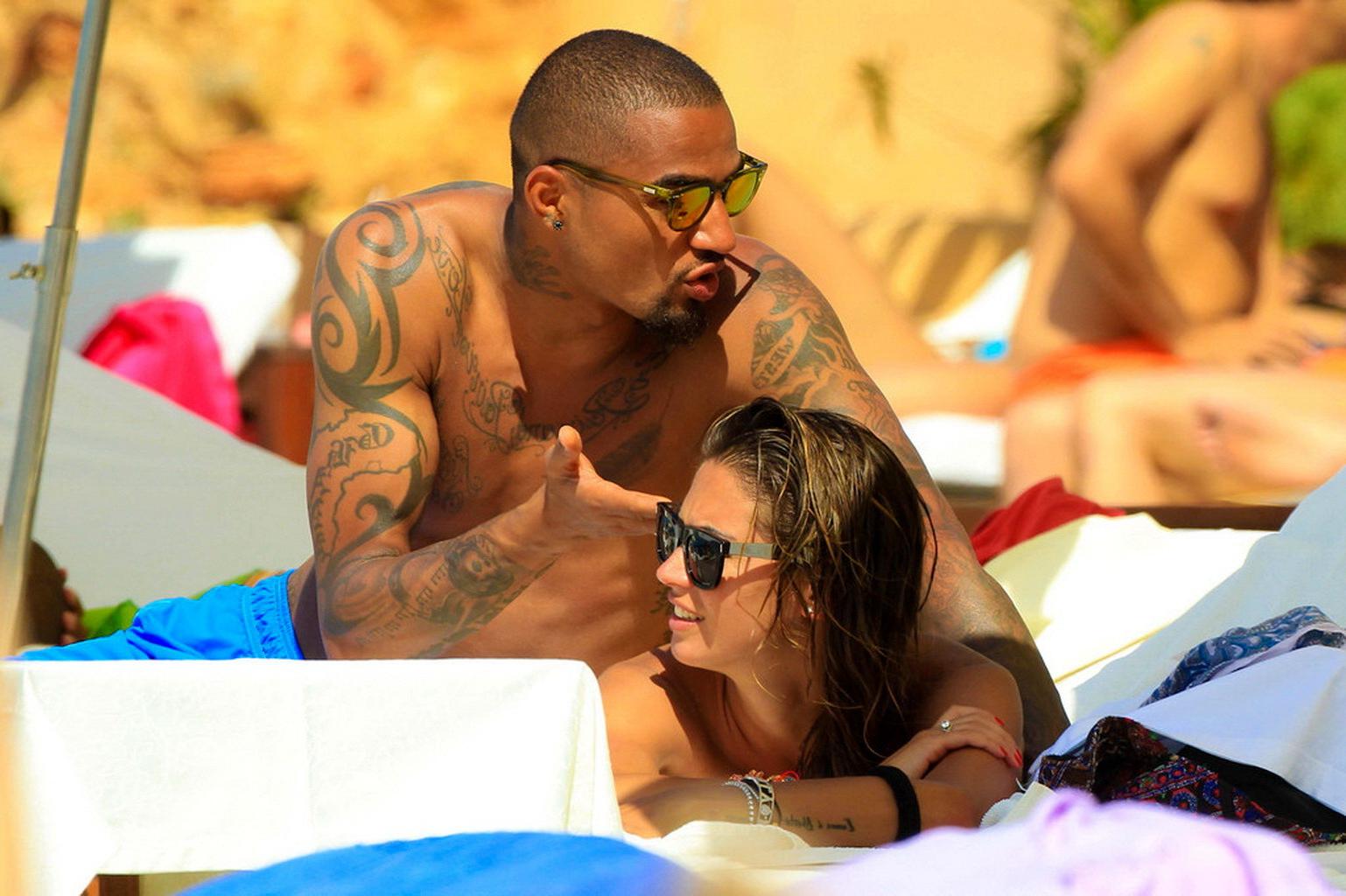 16P Busty Melissa Satta wearing a tube bikini on a beach in Ibiza