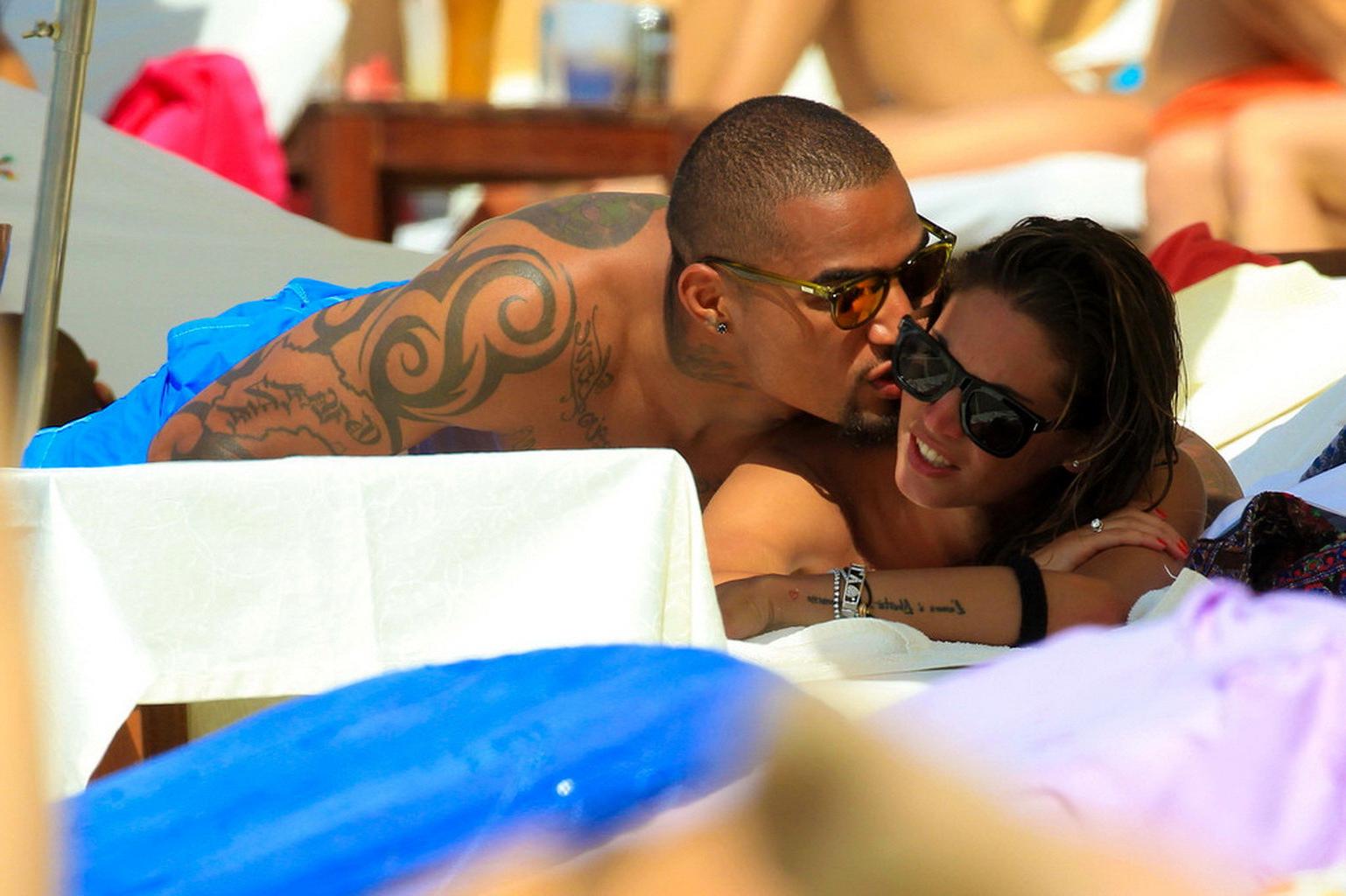 16P Busty Melissa Satta wearing a tube bikini on a beach in Ibiza