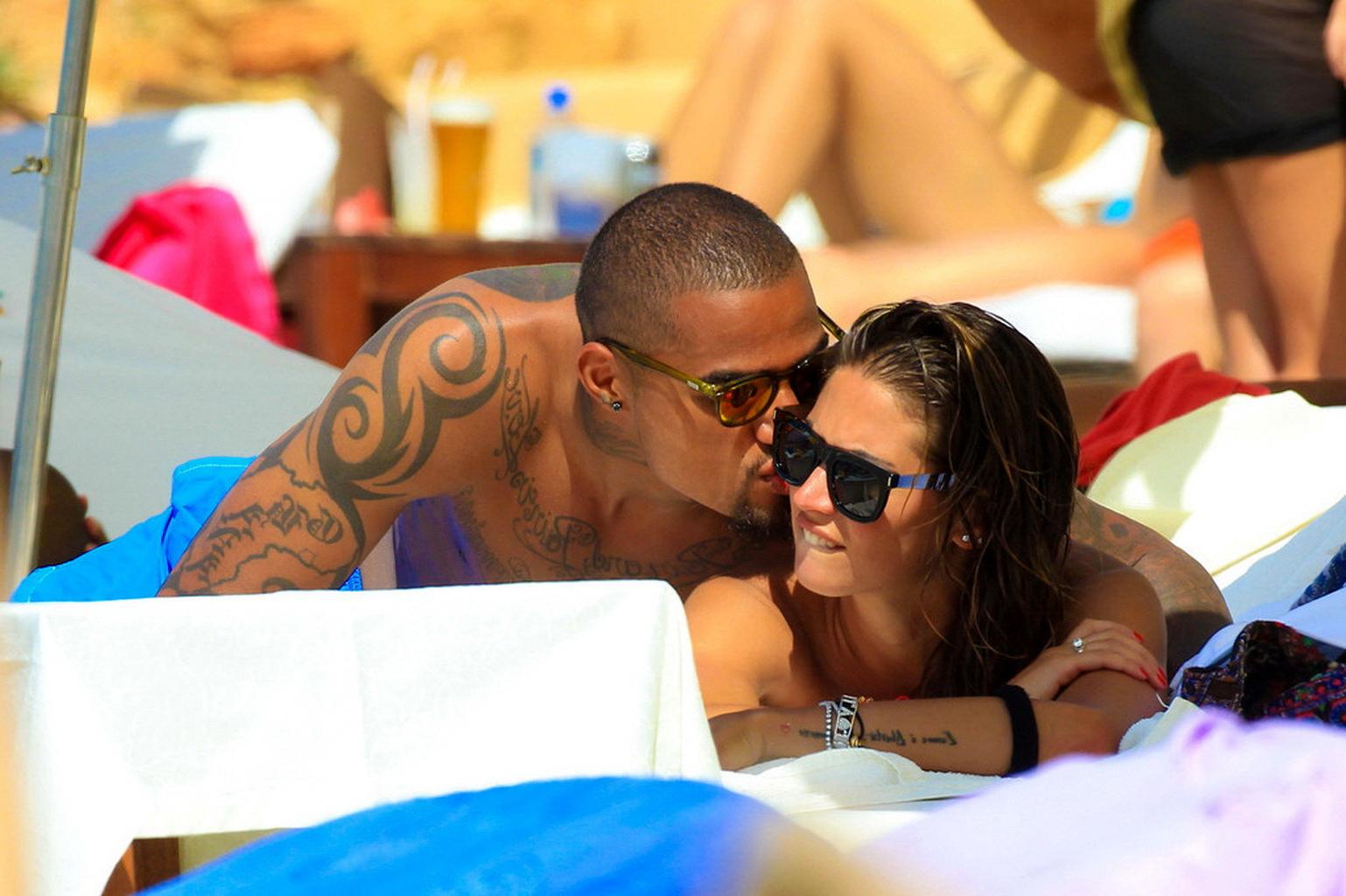 16P Busty Melissa Satta wearing a tube bikini on a beach in Ibiza