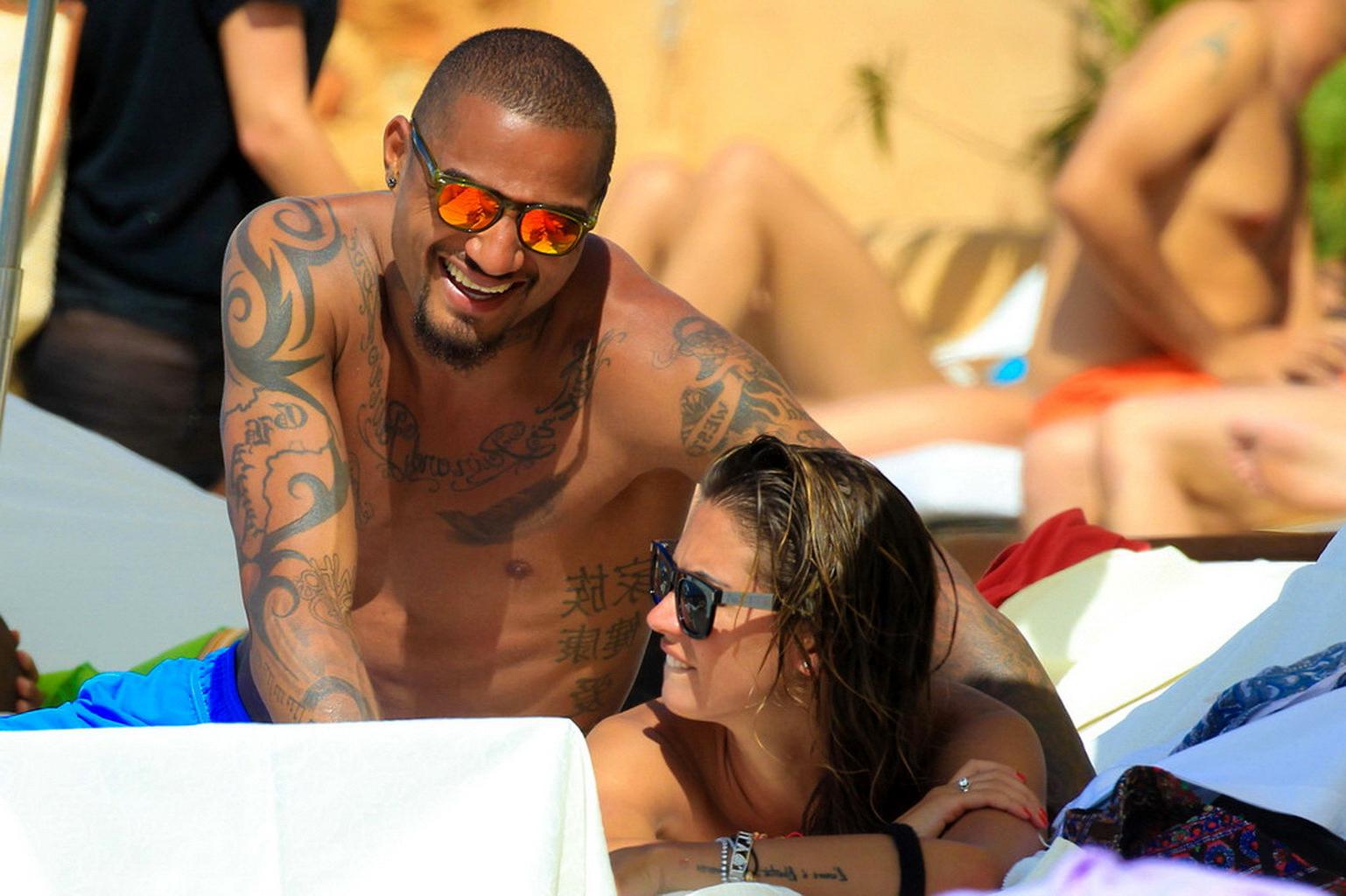 16P Busty Melissa Satta wearing a tube bikini on a beach in Ibiza