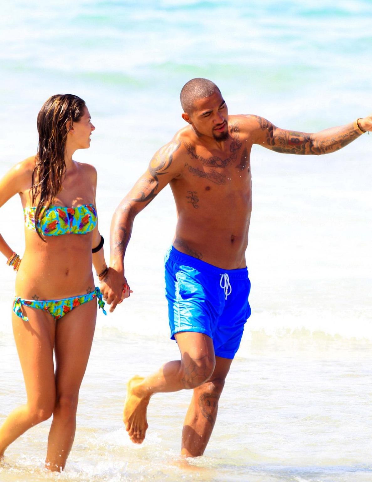 16P Busty Melissa Satta wearing a tube bikini on a beach in Ibiza
