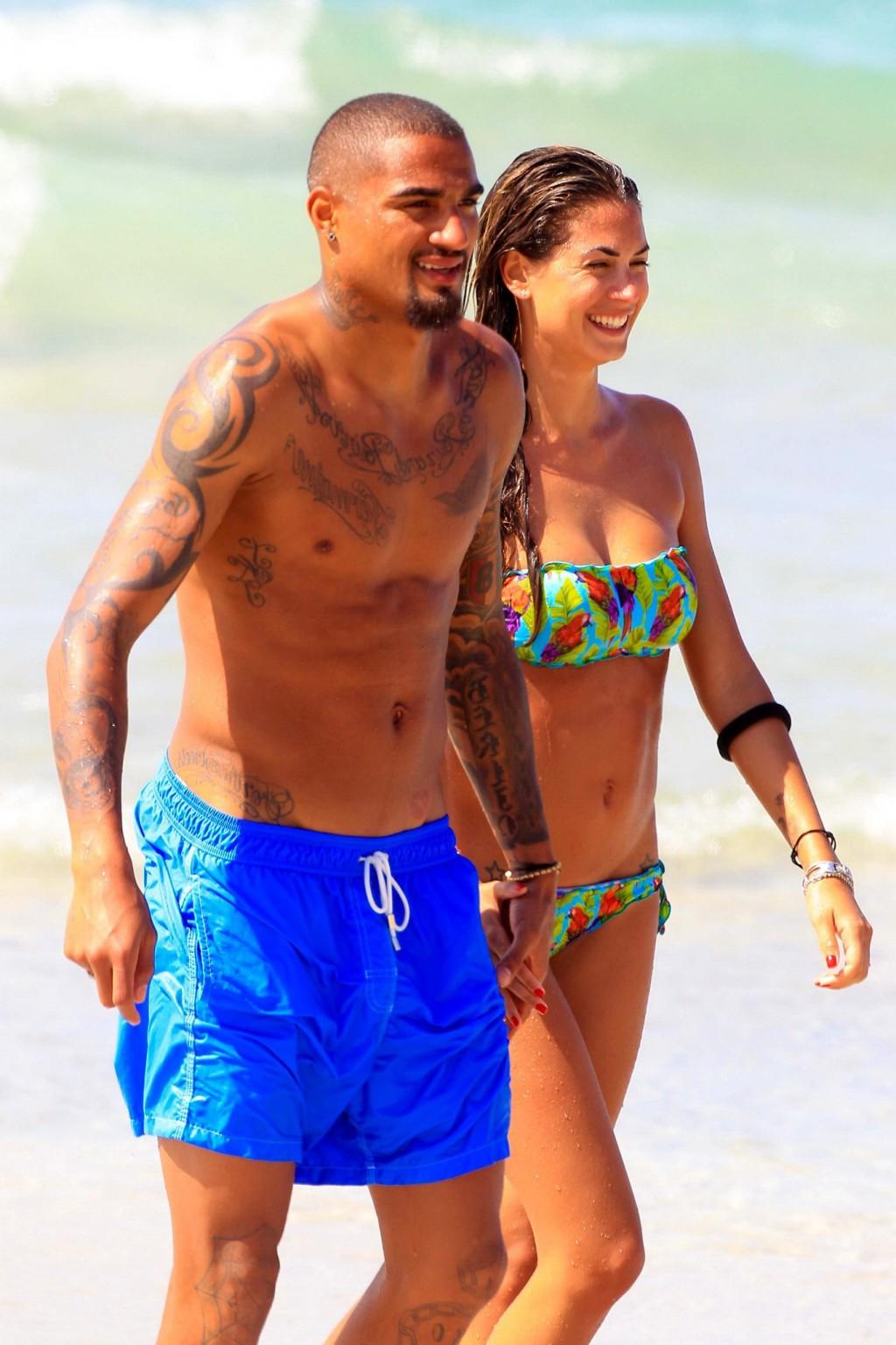 16P Busty Melissa Satta wearing a tube bikini on a beach in Ibiza