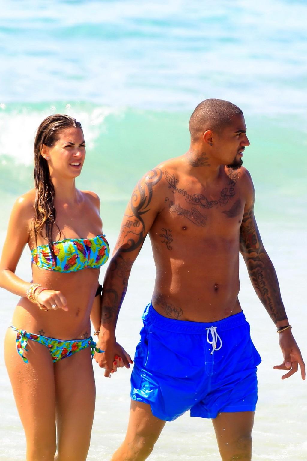16P Busty Melissa Satta wearing a tube bikini on a beach in Ibiza