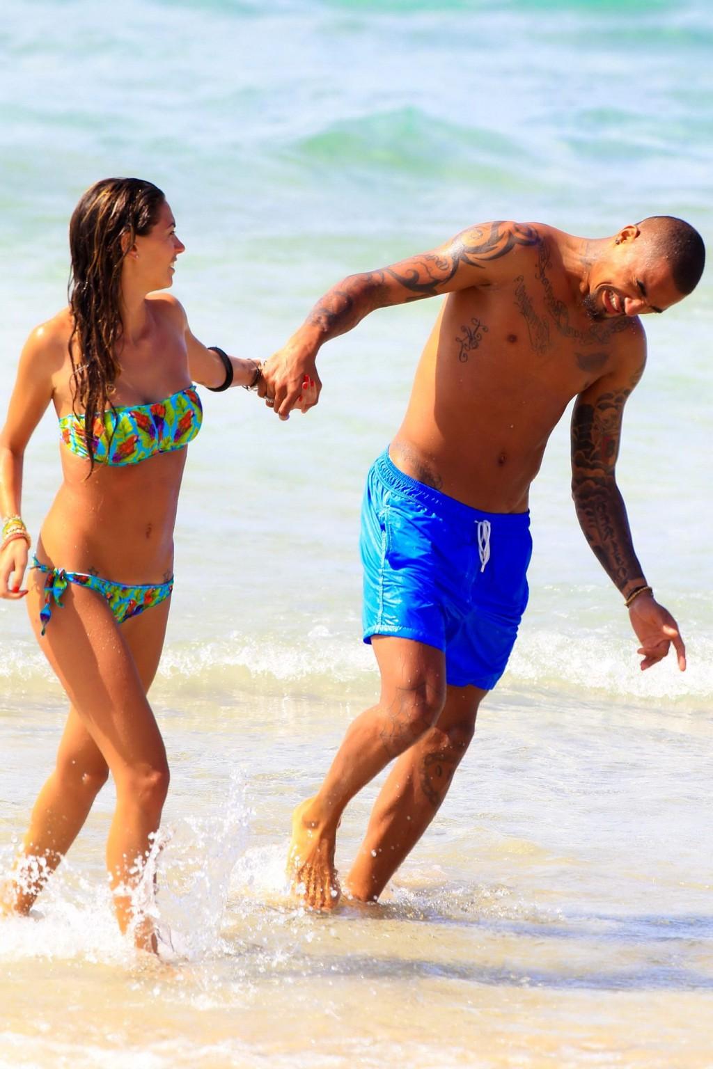 16P Busty Melissa Satta wearing a tube bikini on a beach in Ibiza