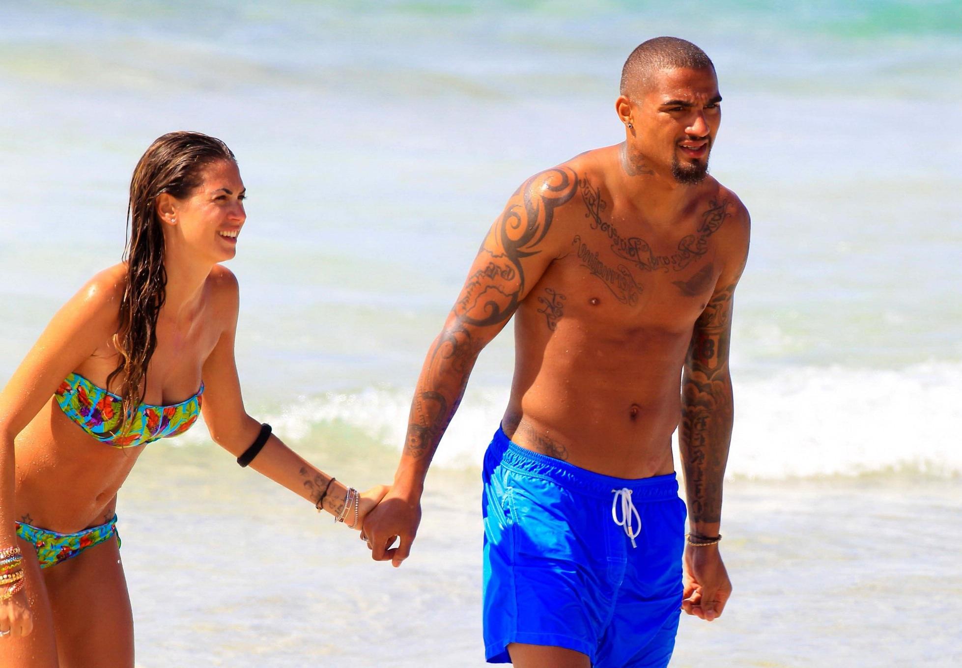 16P Busty Melissa Satta wearing a tube bikini on a beach in Ibiza