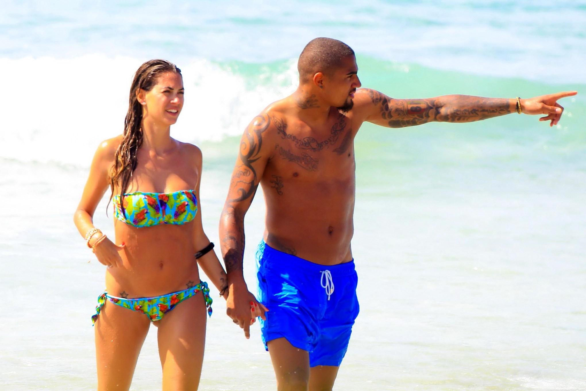 16P Busty Melissa Satta wearing a tube bikini on a beach in Ibiza