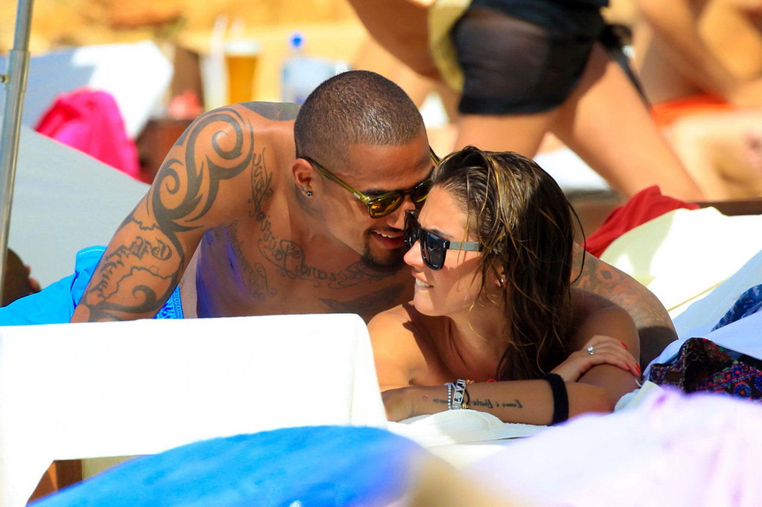 16P Busty Melissa Satta wearing a tube bikini on a beach in Ibiza