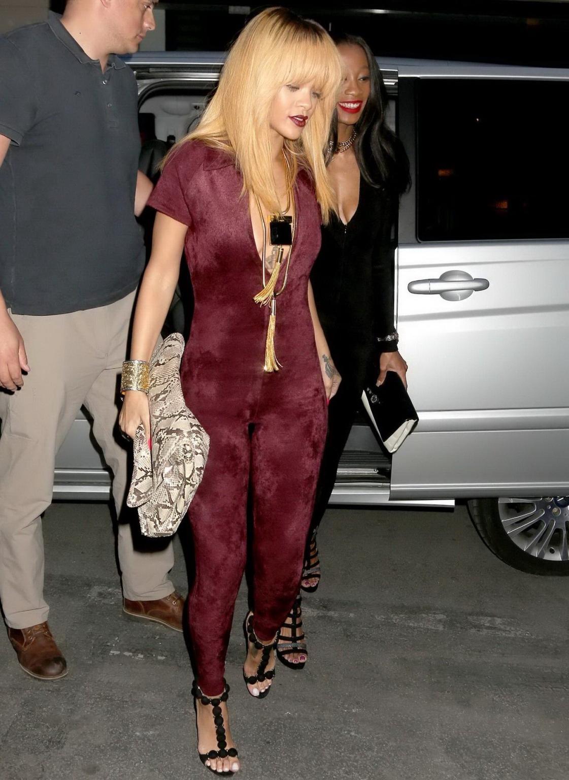 16P Rihanna braless shows cleavage wearing a wide open catsuit for the Azzedine Alai