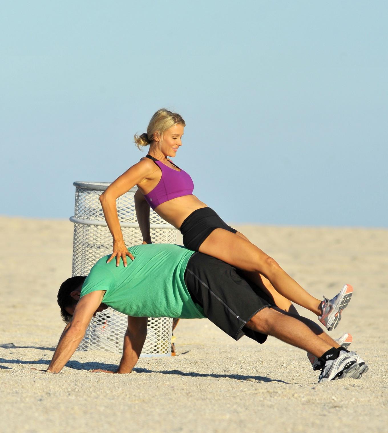 10P Joanna Krupa in tight shorts and sport bra at Miami Beach getting groped or just
