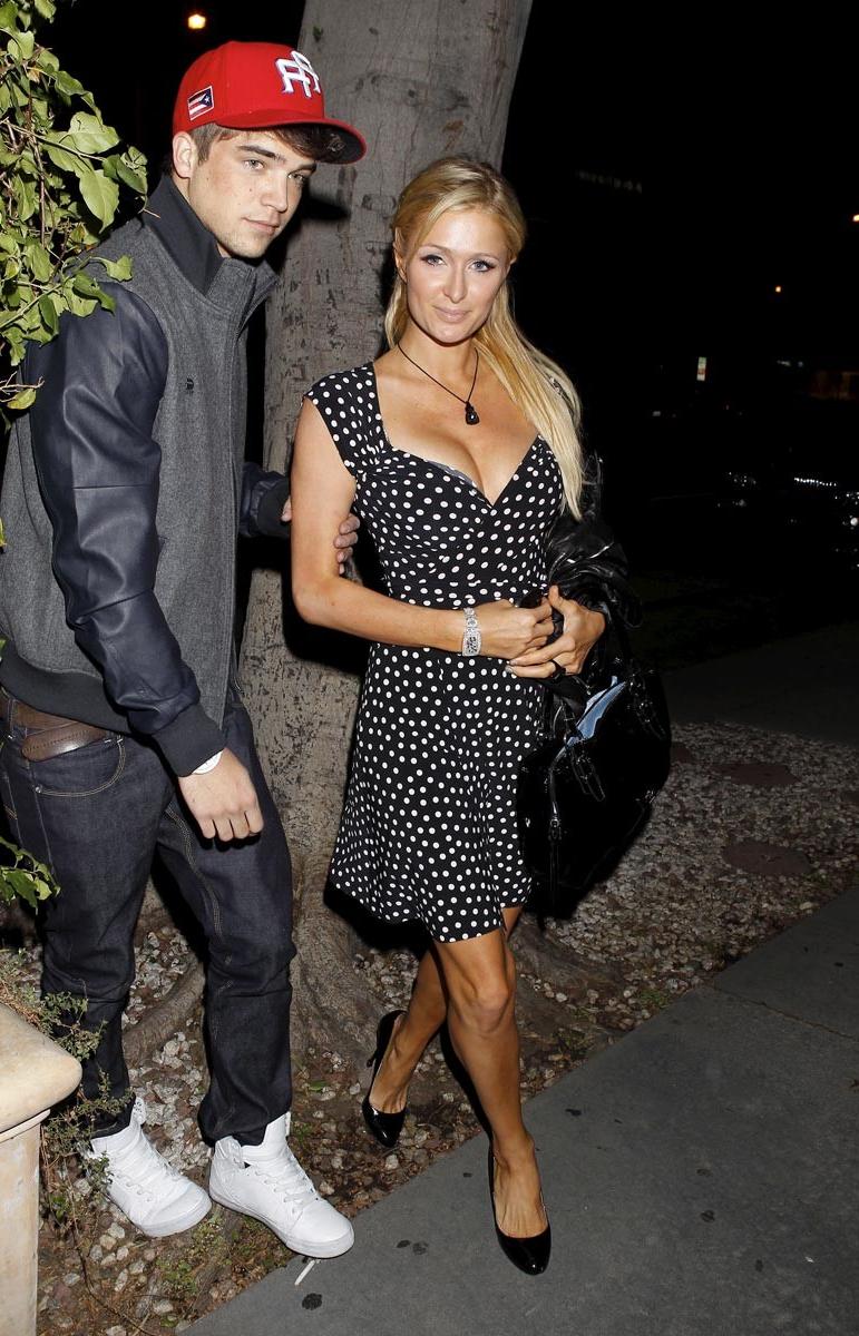 15P Paris Hilton gives nice view of her perky tits