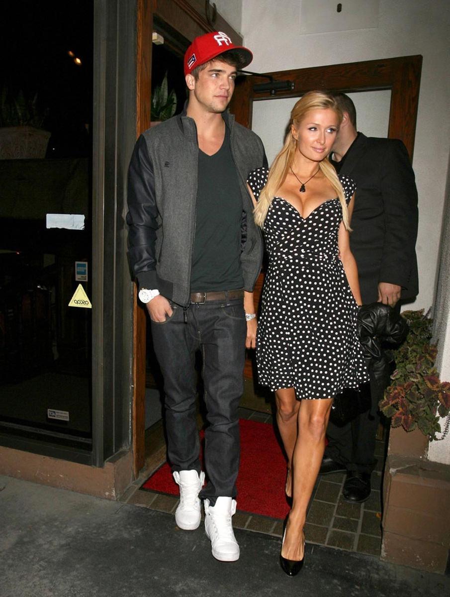 15P Paris Hilton gives nice view of her perky tits
