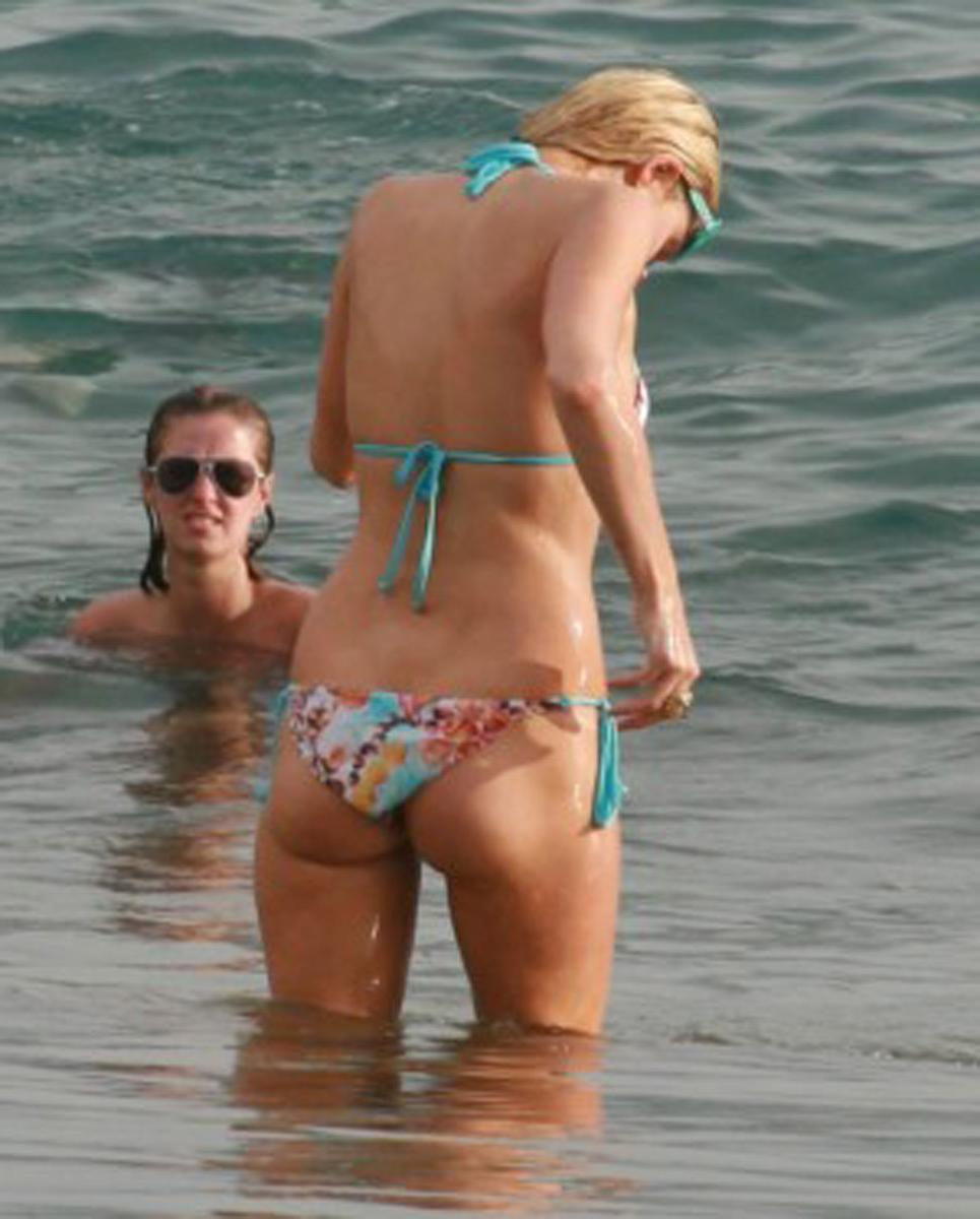 15P Paris Hilton gives nice view of her perky tits