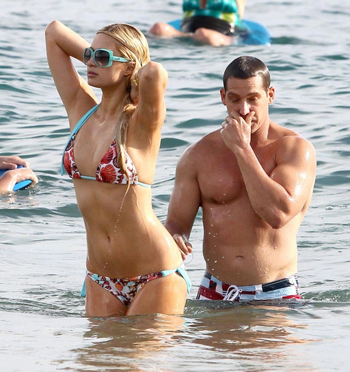 15P Paris Hilton gives nice view of her perky tits
