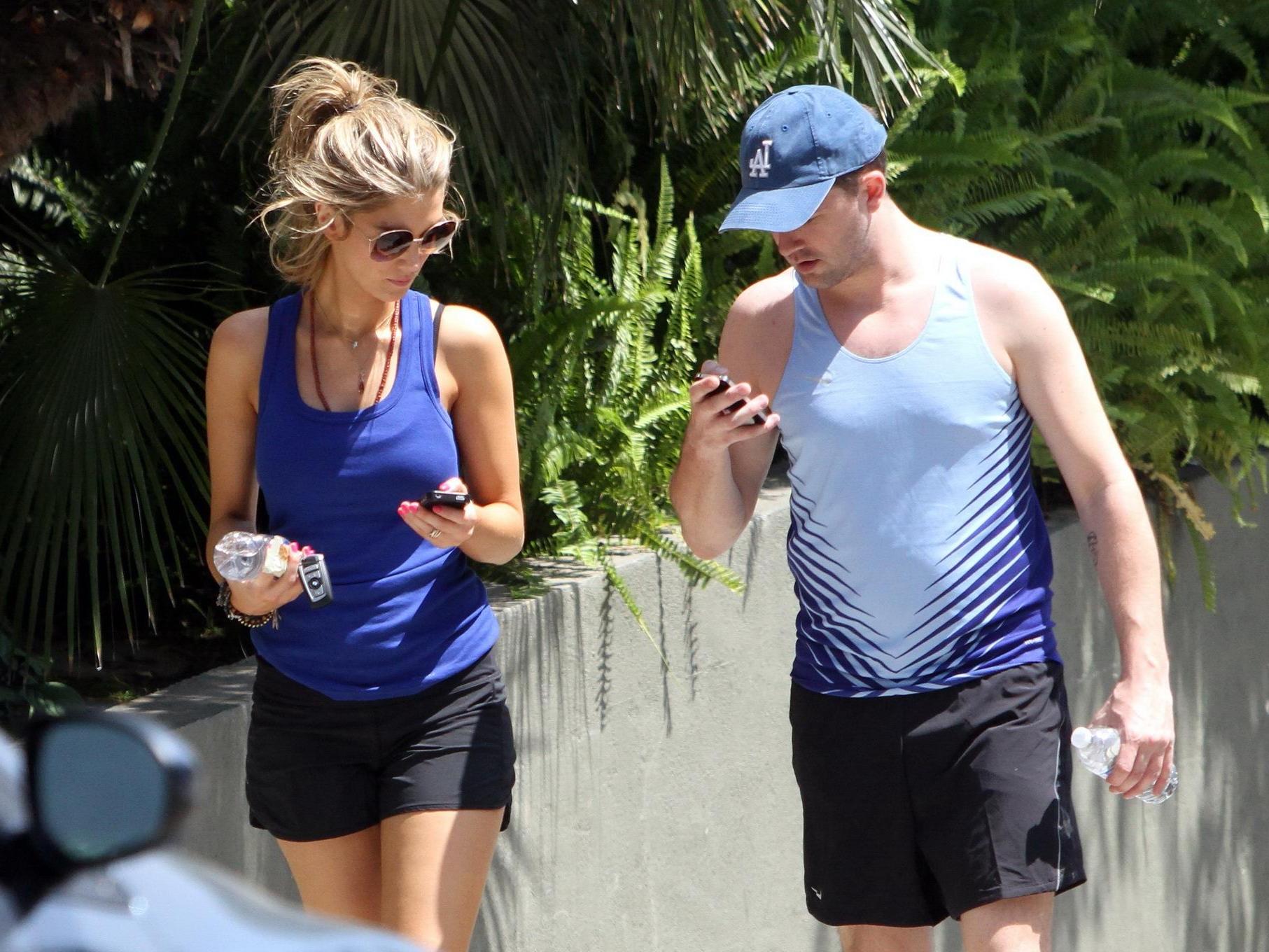 10P Delta Goodrem hiking in LA wearing sports bra  shorts
