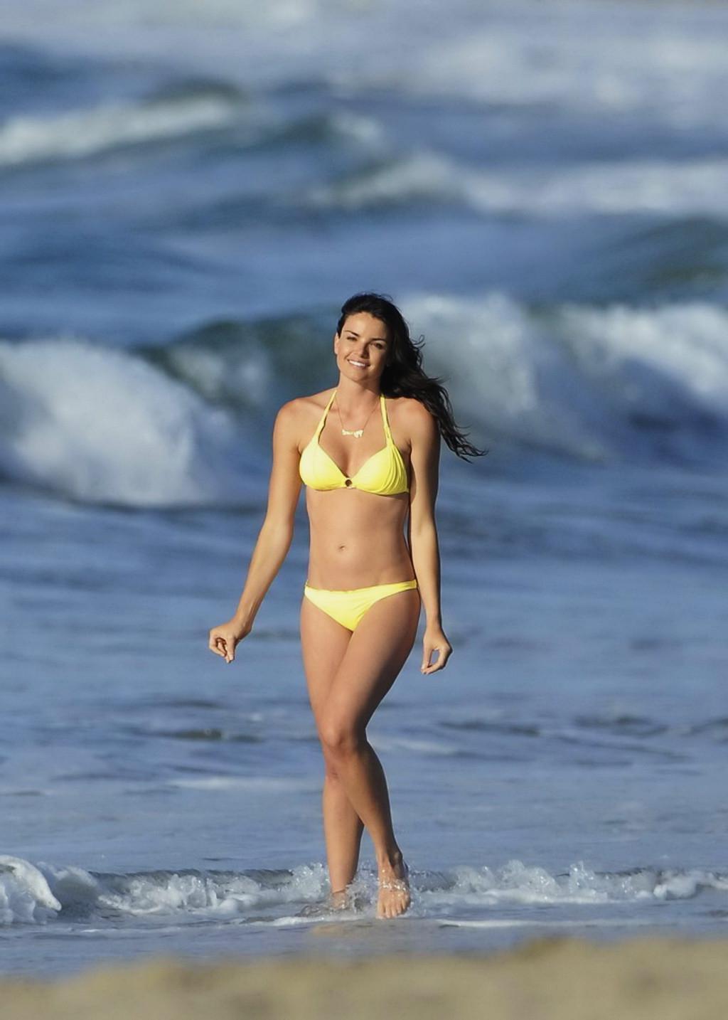 10P Courtney Robertson showing off her hot body wearing skimpy yellow bikini at the 