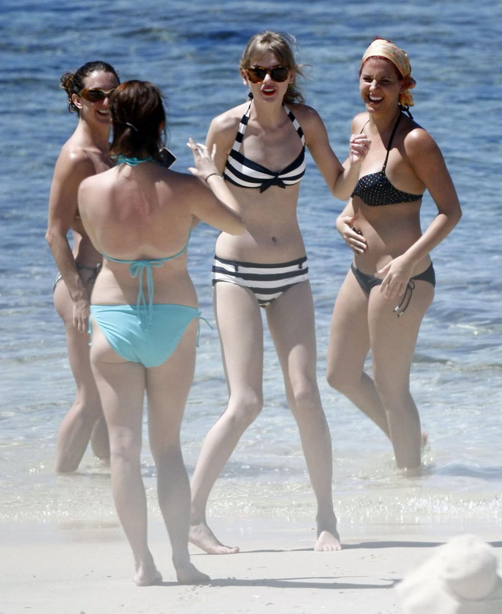16P Taylor Swift caught wearing bikini on a beach in Perth