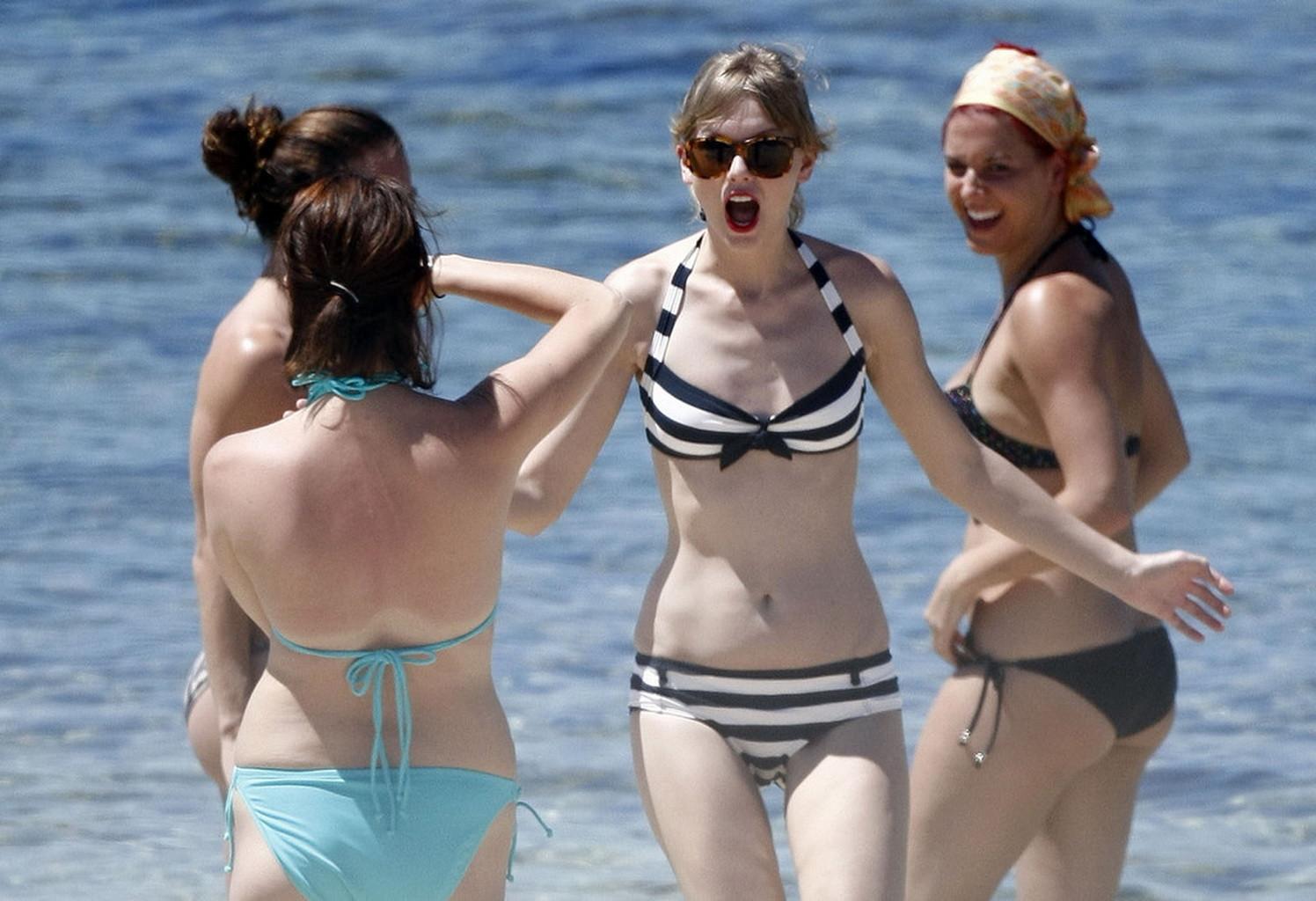 16P Taylor Swift caught wearing bikini on a beach in Perth