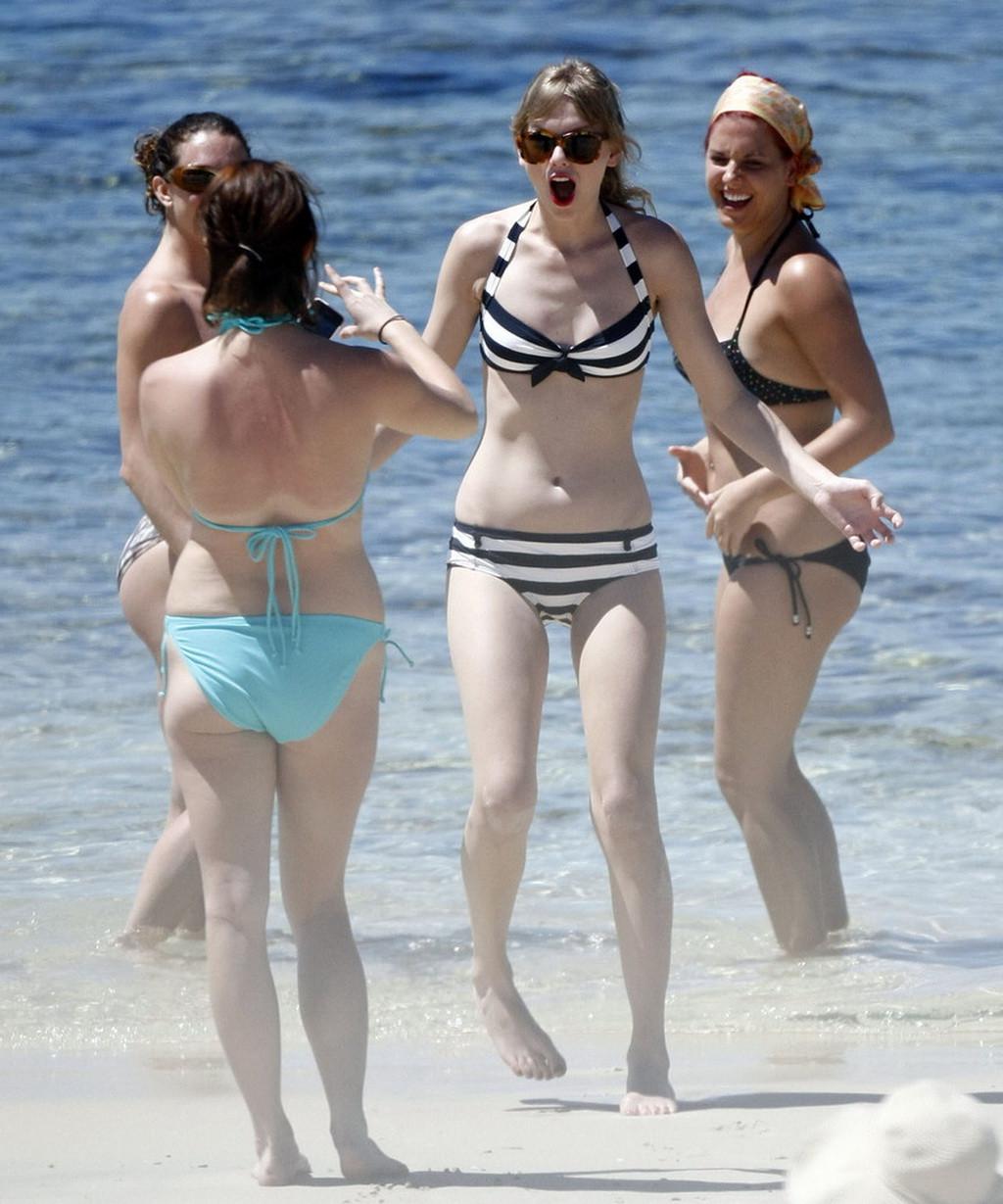 16P Taylor Swift caught wearing bikini on a beach in Perth