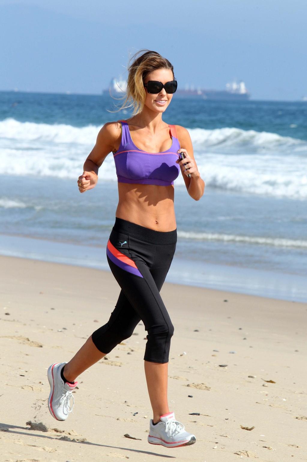 16P Audrina Patridge in sports bra  tights jogging on the beach in LA