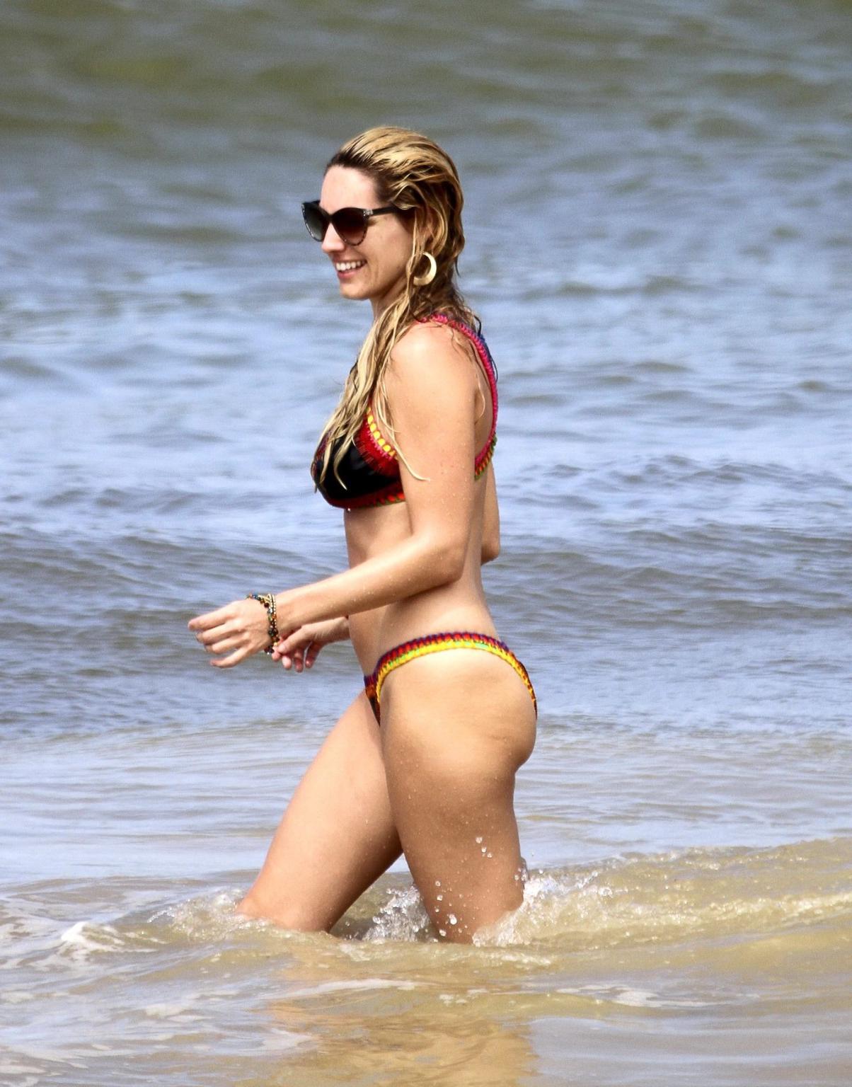 16P Kelly Brook showing off her curvy bikini body on a beach in Ibiza