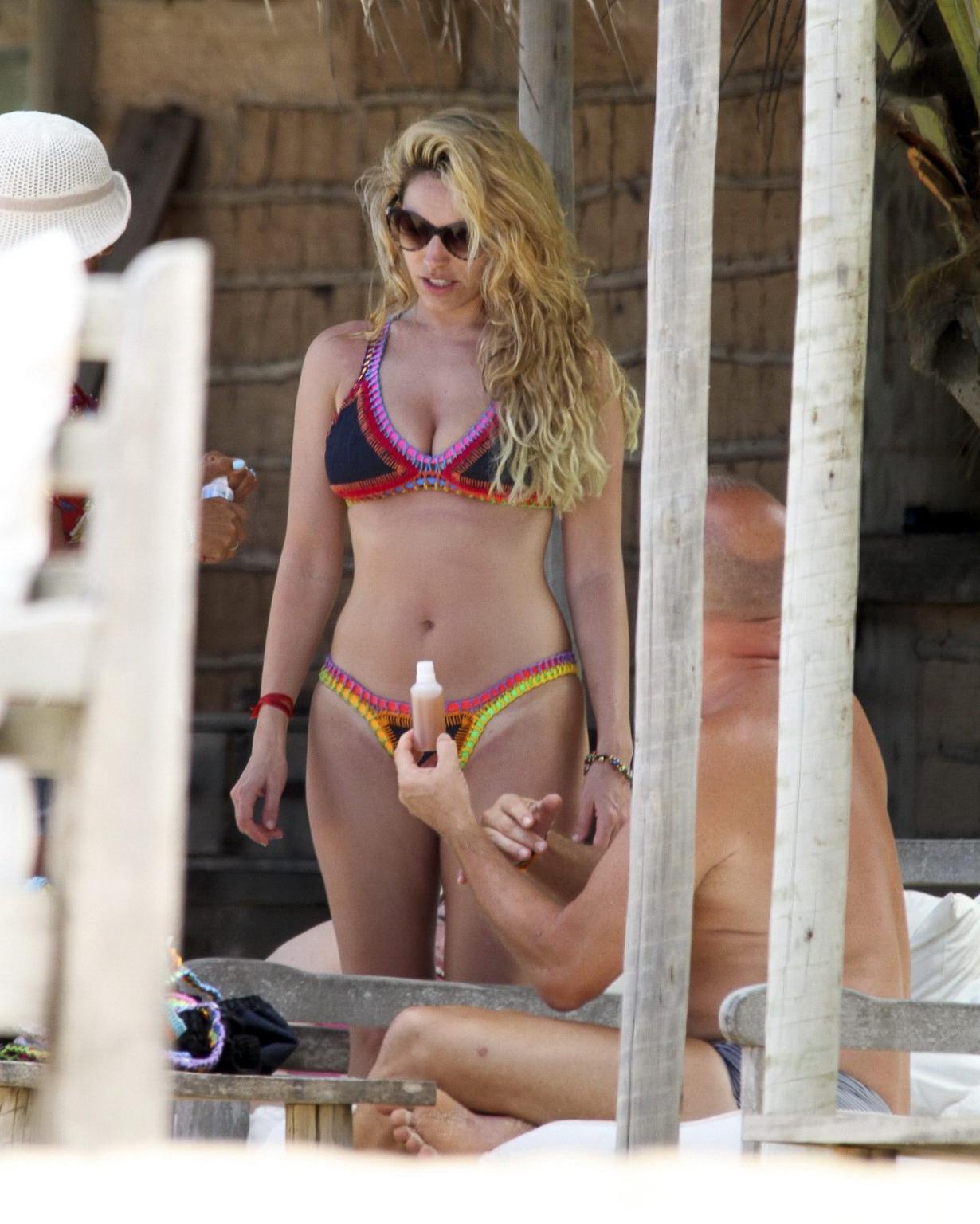 16P Kelly Brook showing off her curvy bikini body on a beach in Ibiza