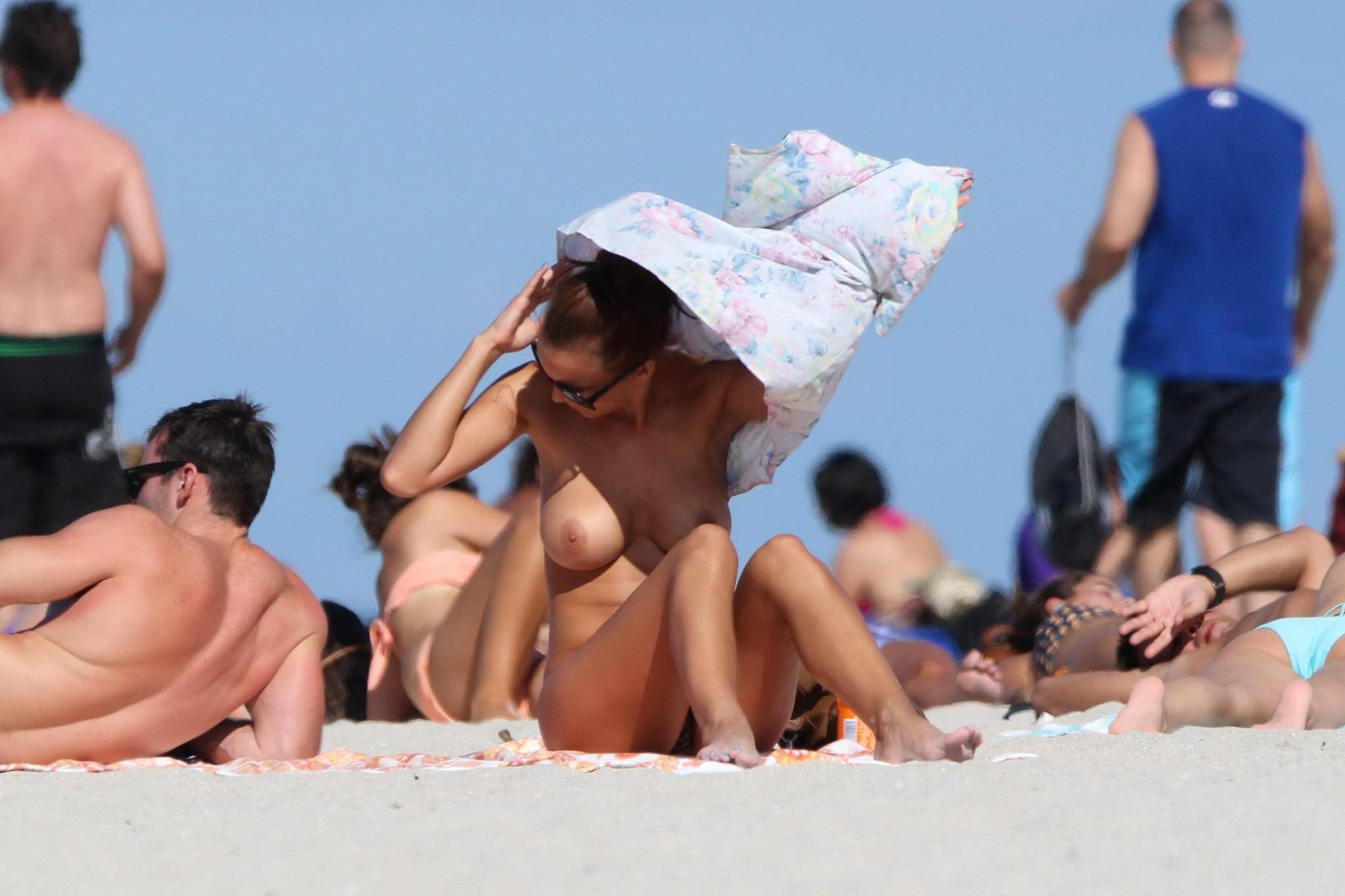 16P Rosie Jones caught tanning topless on Miami Beach