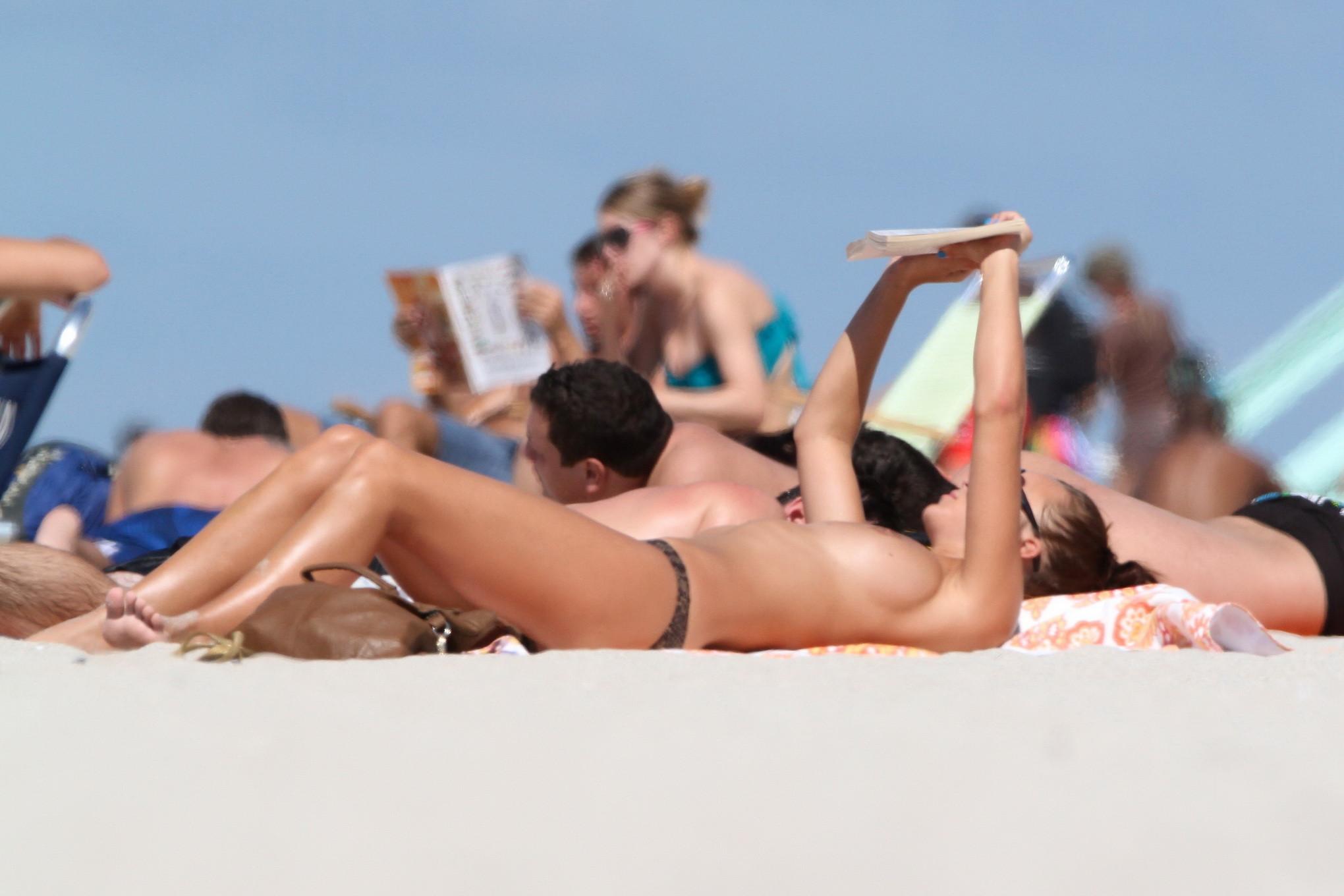 16P Rosie Jones caught tanning topless on Miami Beach