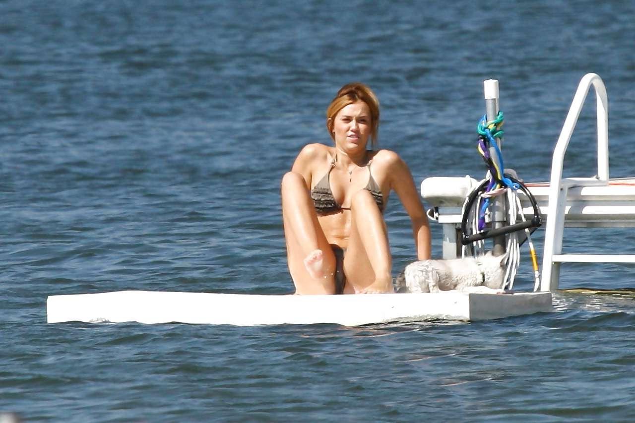 16P Miley Cyrus looking very cute for new photoshoot and posing braless