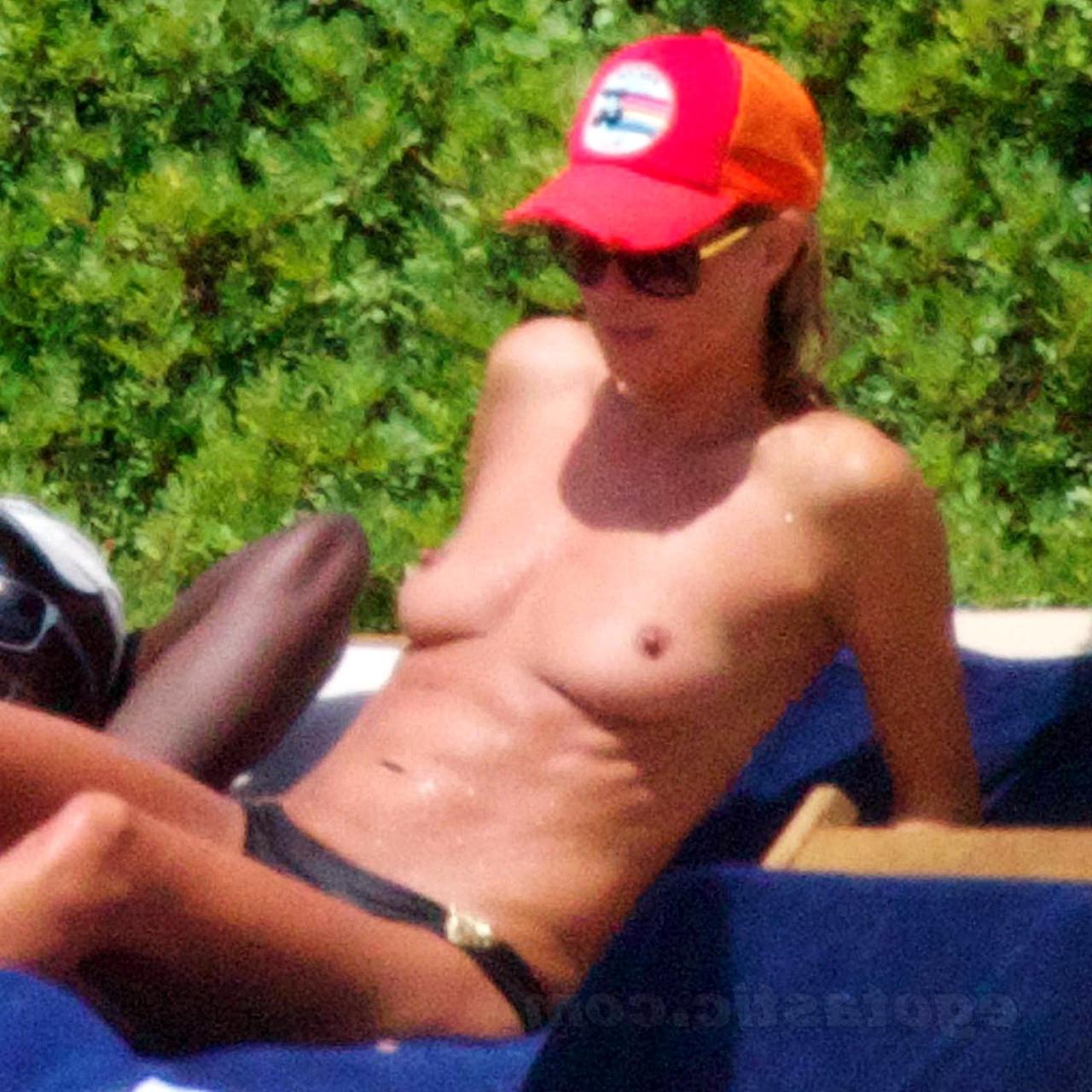 16P Heidi Klum caught topless on the beach in Sardinia
