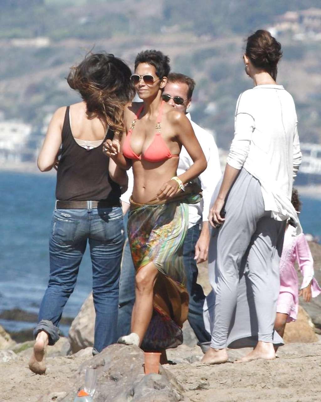 16P Halle Berry show big cleavage in bikini on beach and flashing panties caught by 