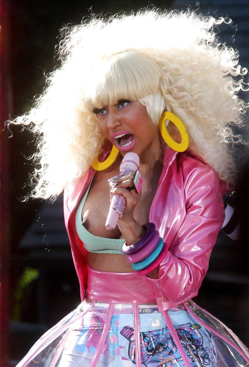 14P Nicki Minaj showing her tits and nipple during performance caught by paparazzi