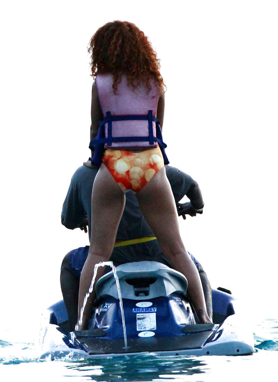 16P Rihanna all wet and sexy in swimsuit on beach caught by paparazzi
