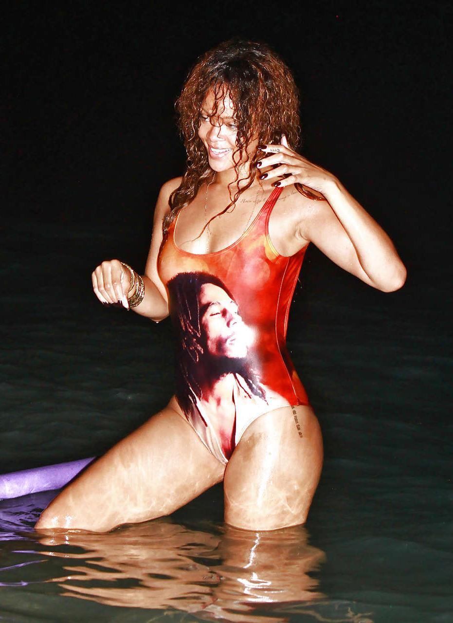16P Rihanna all wet and sexy in swimsuit on beach caught by paparazzi