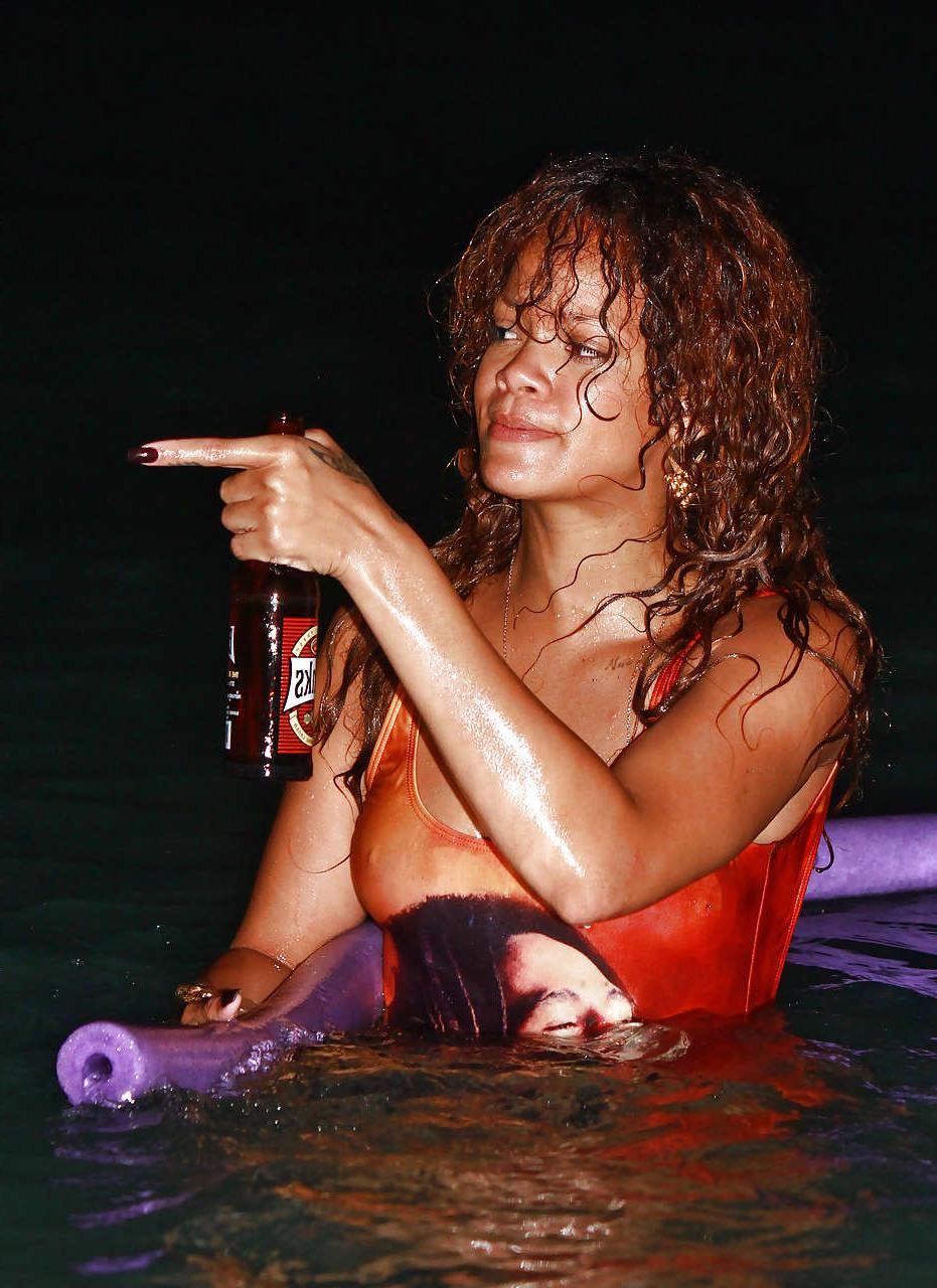 16P Rihanna all wet and sexy in swimsuit on beach caught by paparazzi