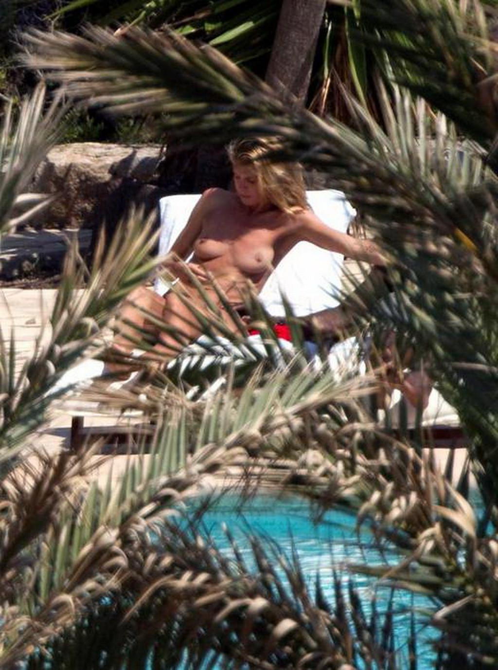 16P Heidi Klum caught sunbathing topless on vacation in Ibiza