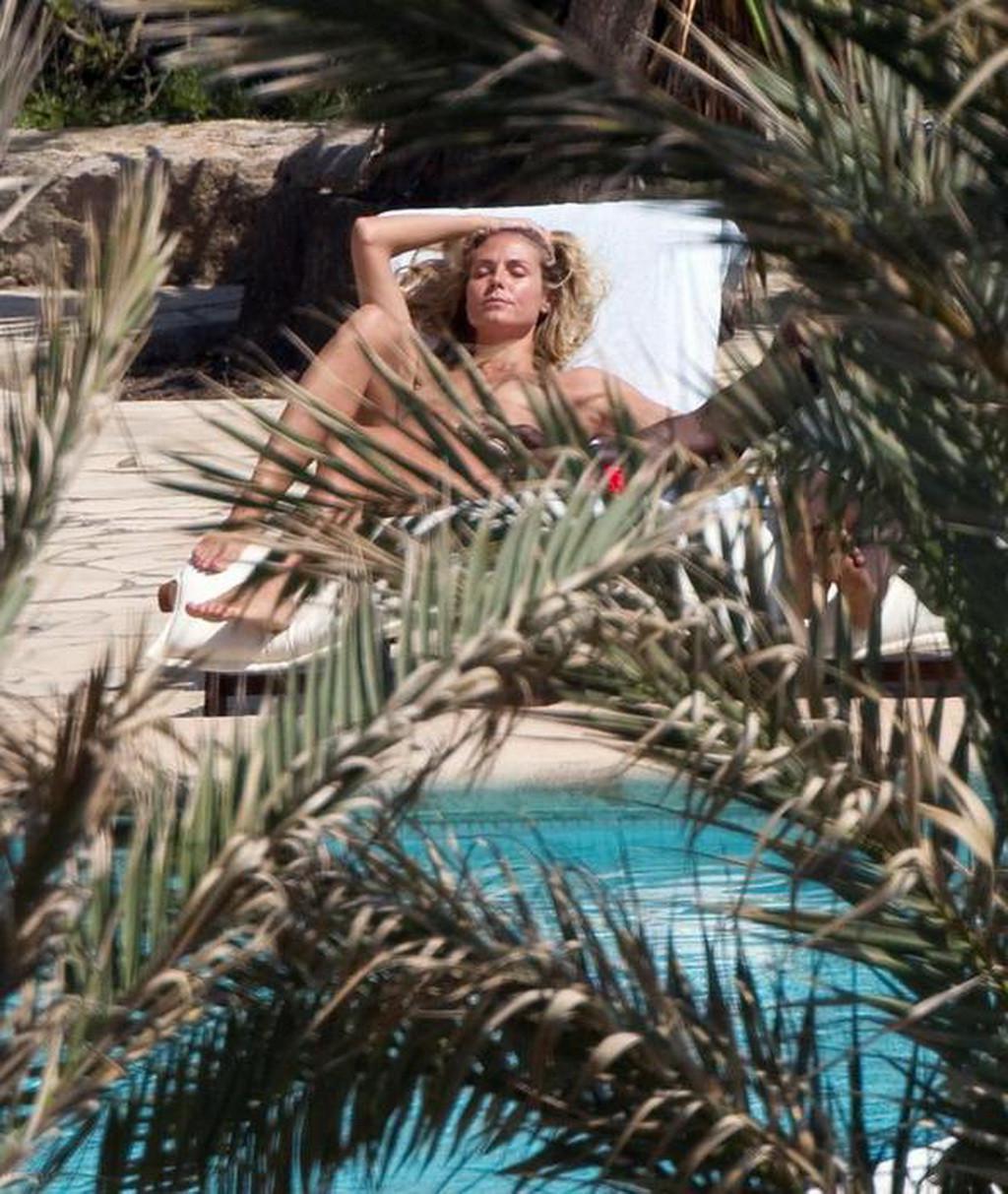 16P Heidi Klum caught sunbathing topless on vacation in Ibiza