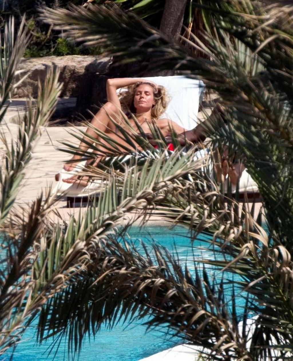 16P Heidi Klum caught sunbathing topless on vacation in Ibiza