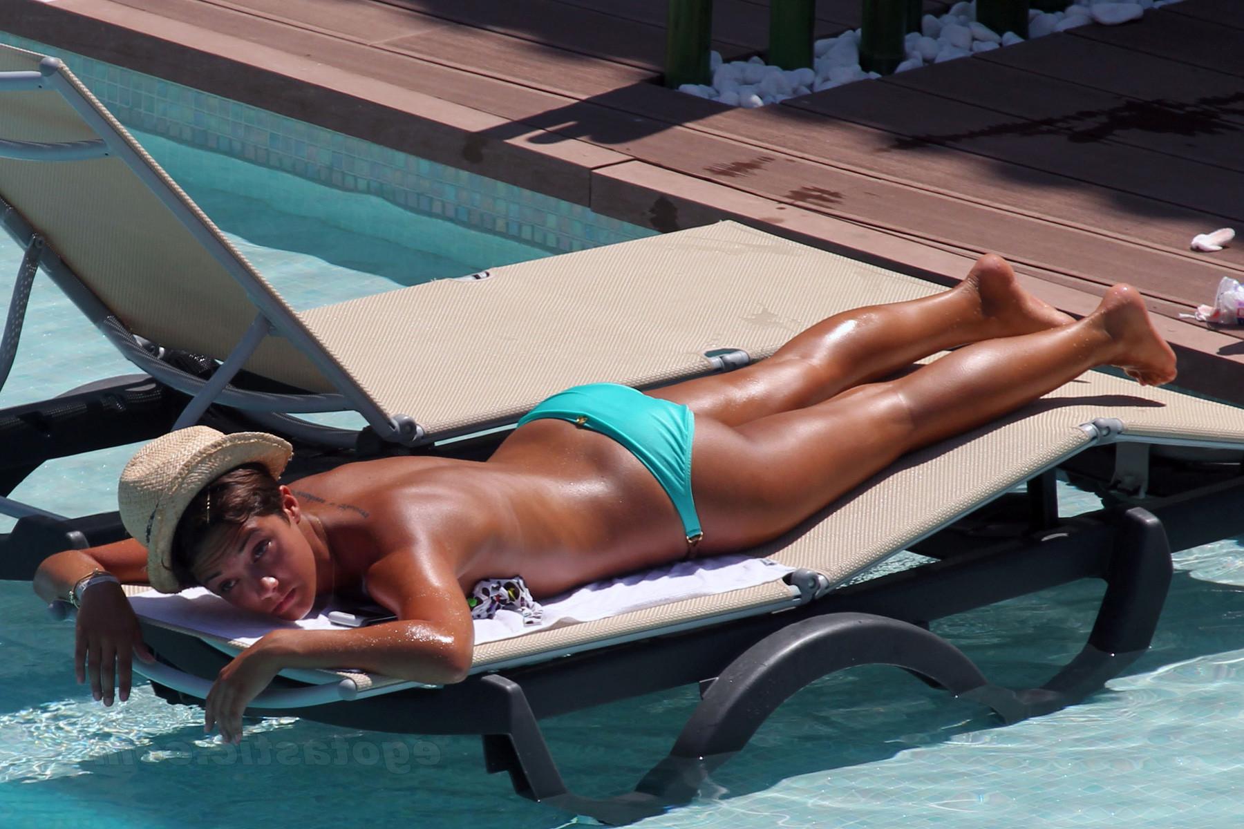 15P Frankie Sandford sunbathing topless on the beach in Ibiza