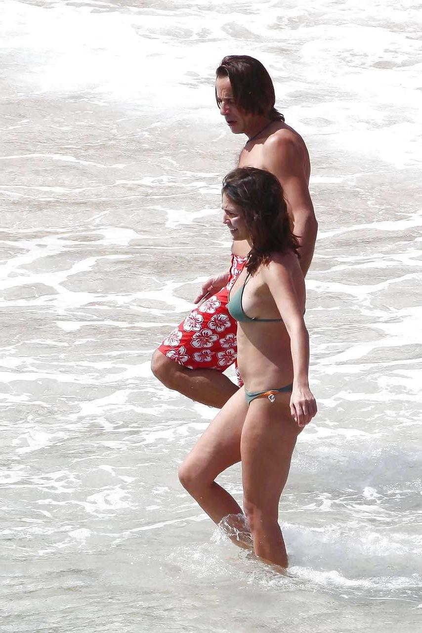 16P Ines Sastre nipple slip on beach caught by paparazzi and posing in bikini