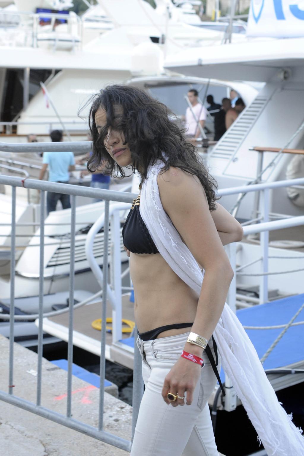 16P Michelle Rodriguez wearing bikini top  showing ass crack at F1 GP in Monaco