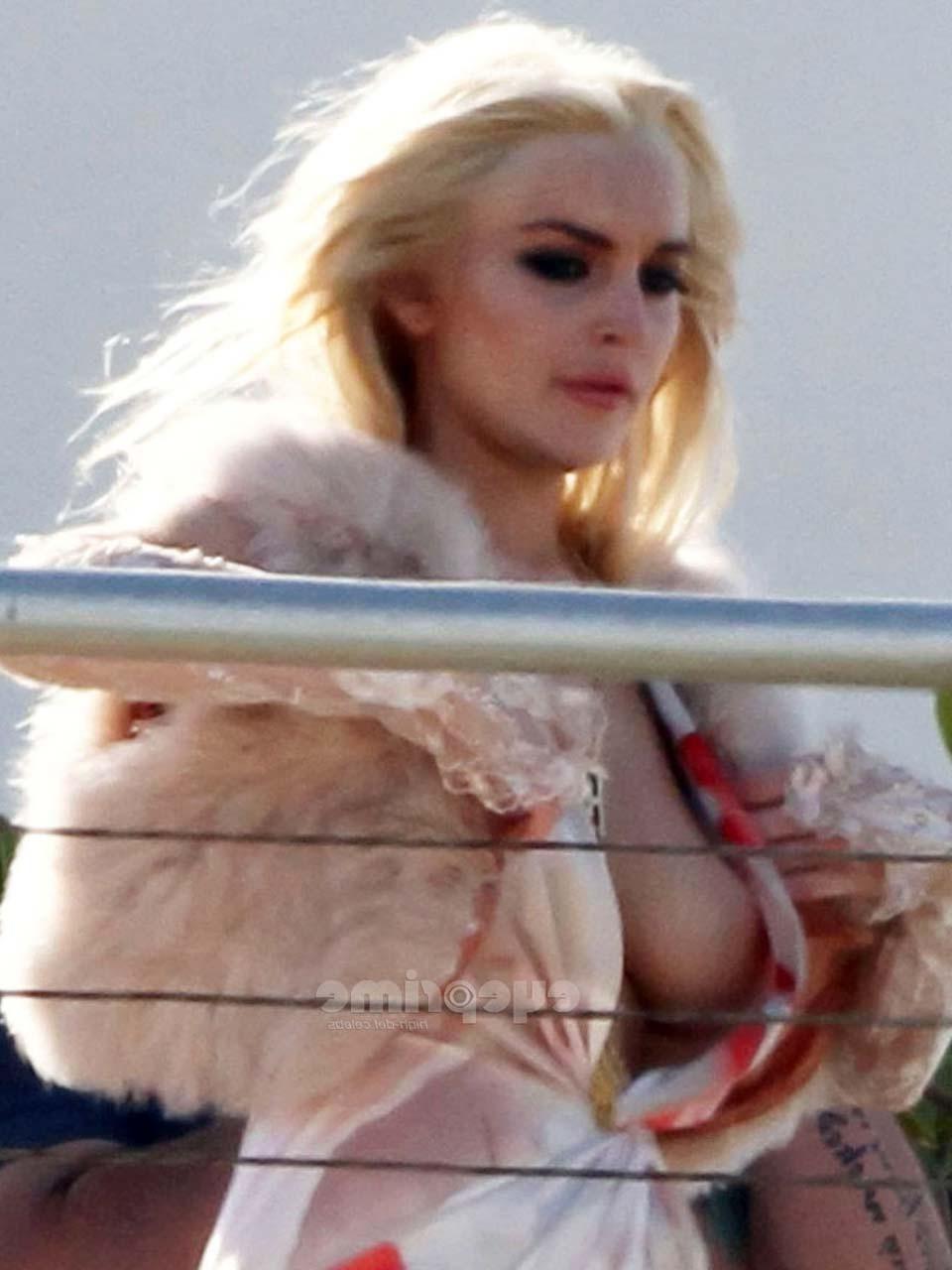 16P Lindsay Lohan flashing her boobs while doing some photoshoot paparazzi pictures