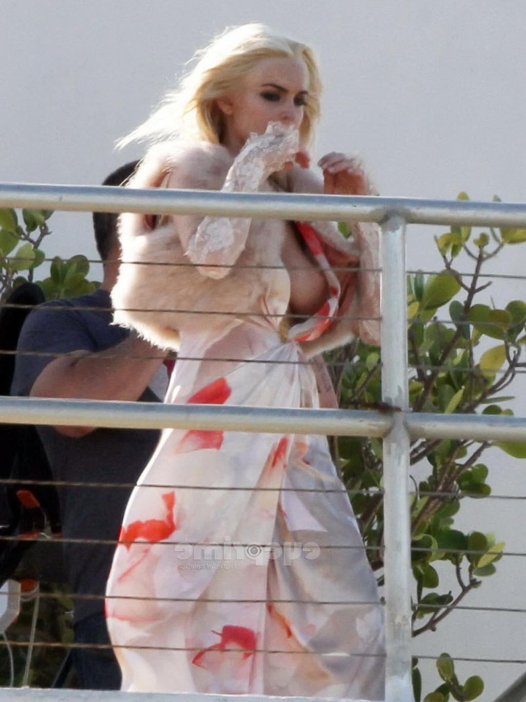 16P Lindsay Lohan upskirt  showing side boob at the photoshoot on a rooftop in Miami