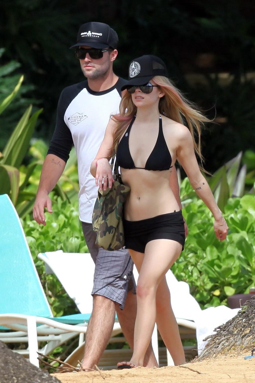 13P Avril Lavigne caught tanning in Hawaii wearing sexy black bikini