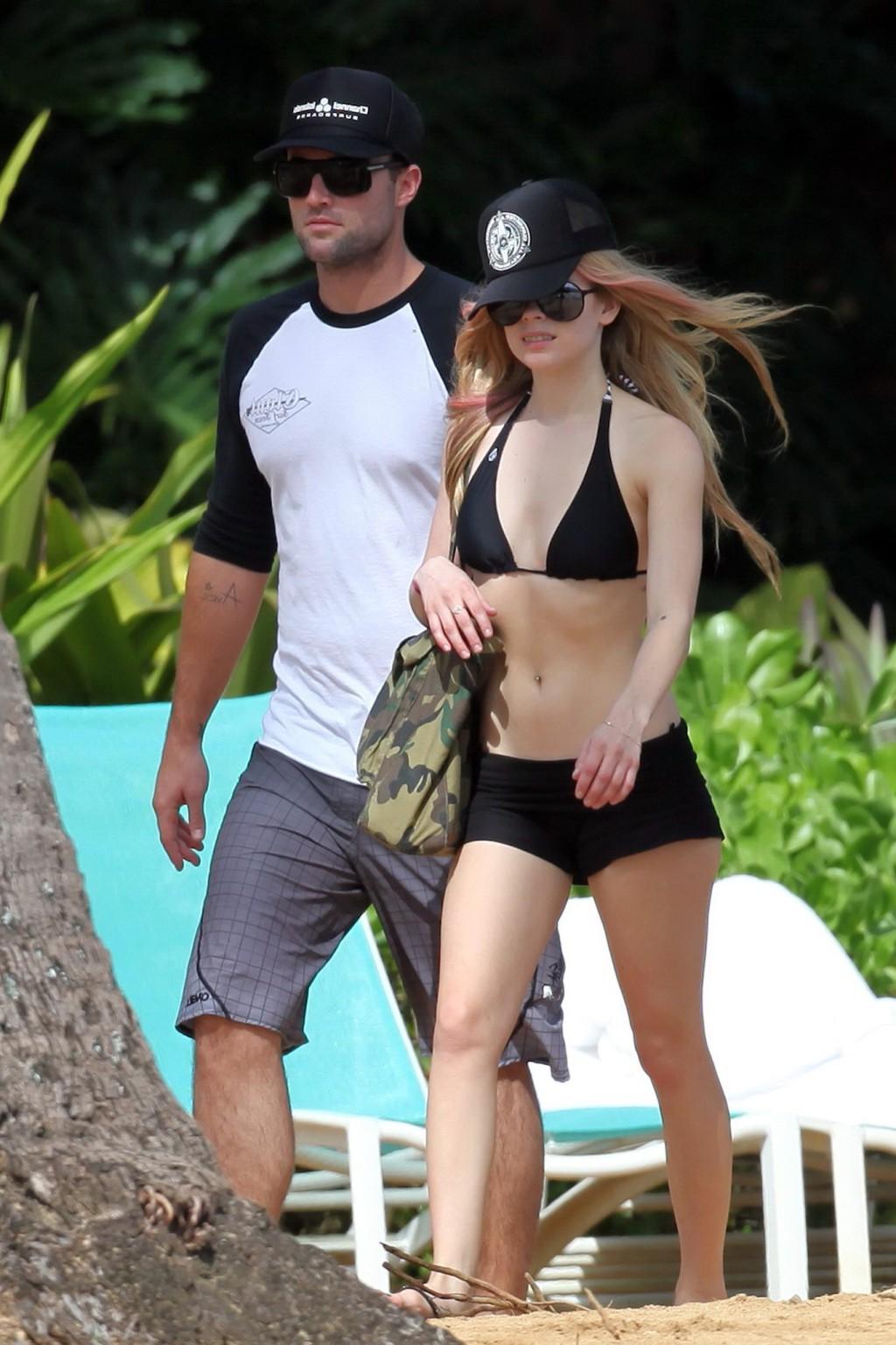 13P Avril Lavigne caught tanning in Hawaii wearing sexy black bikini