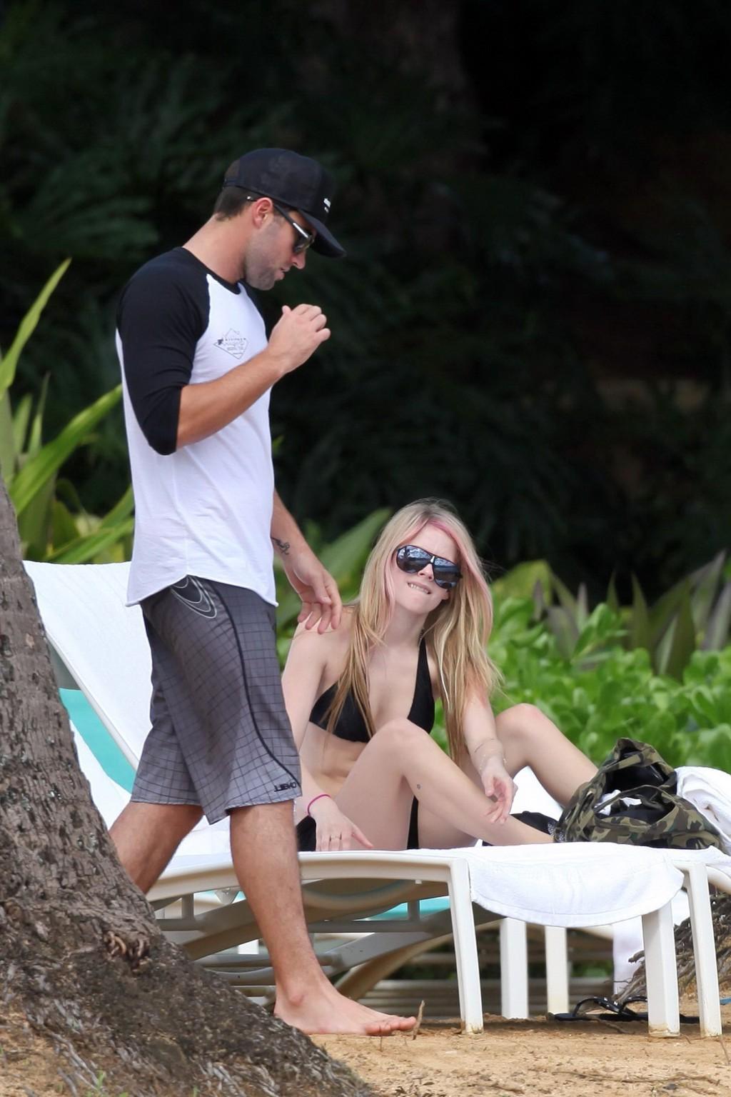 13P Avril Lavigne caught tanning in Hawaii wearing sexy black bikini