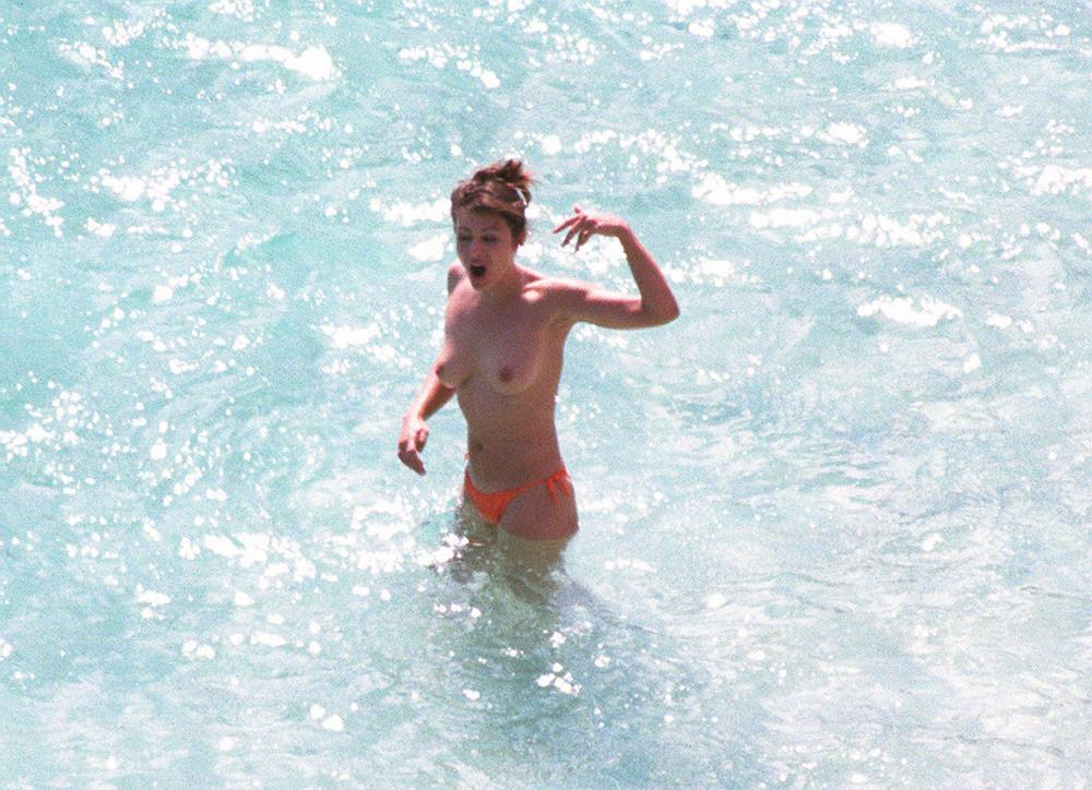 15P Elizabeth Hurley caught suntanning topless