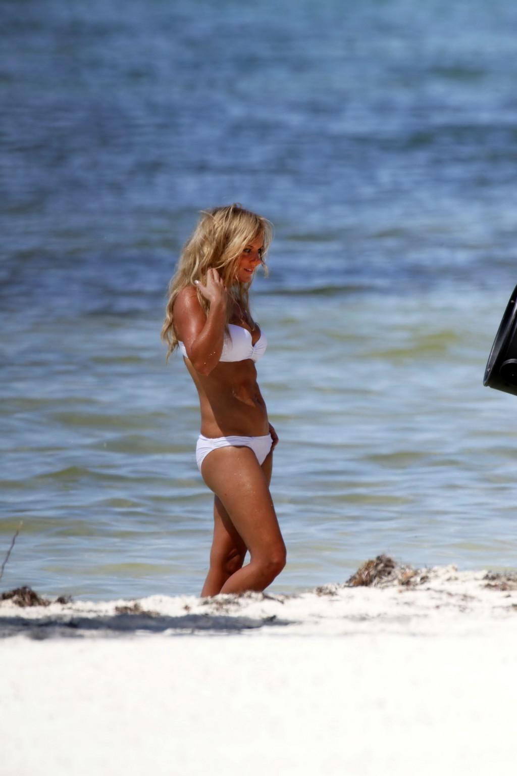 16P Geri Halliwell busty wearing white bikini at the photoshoot in Key West