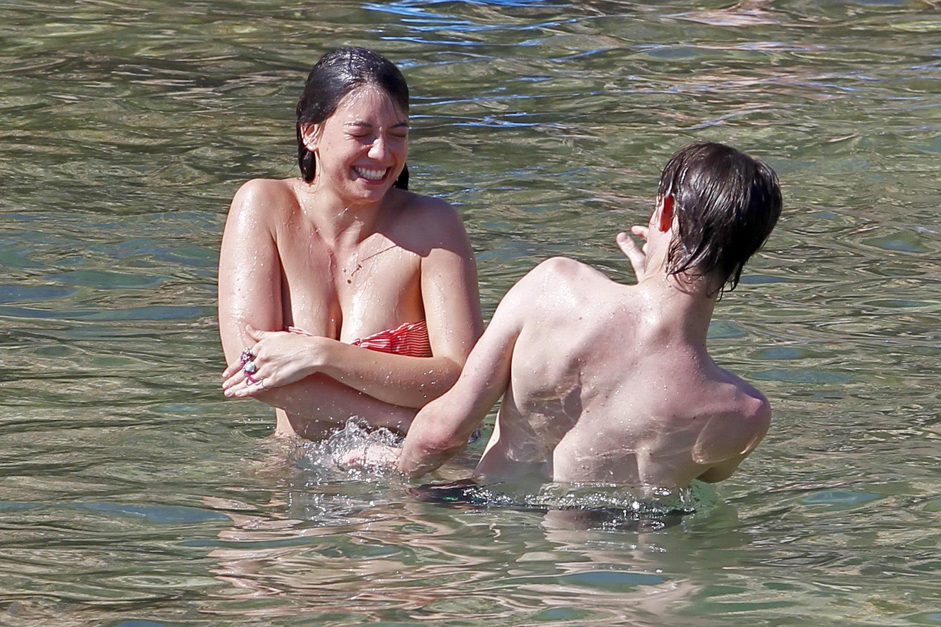 15P Daisy Lowe topless tanning her big boobs on the beach in Ibiza
