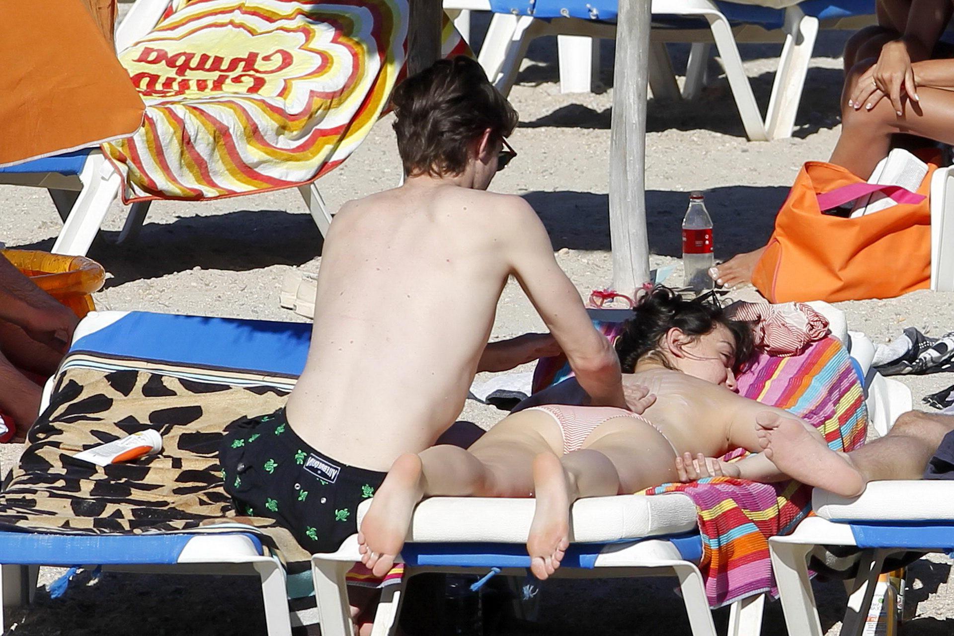 15P Daisy Lowe topless tanning her big boobs on the beach in Ibiza